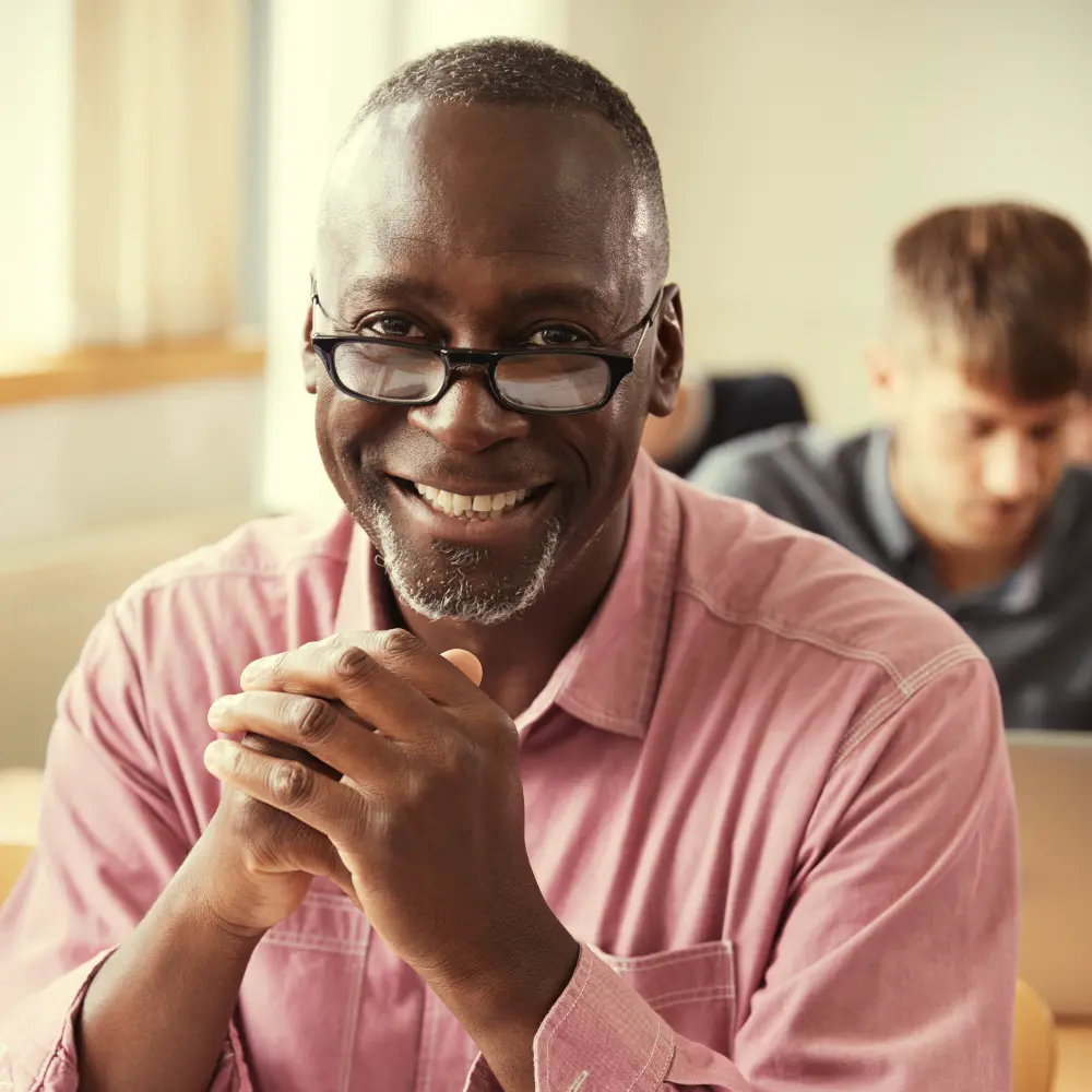 Adult Male sitting in classroom setting